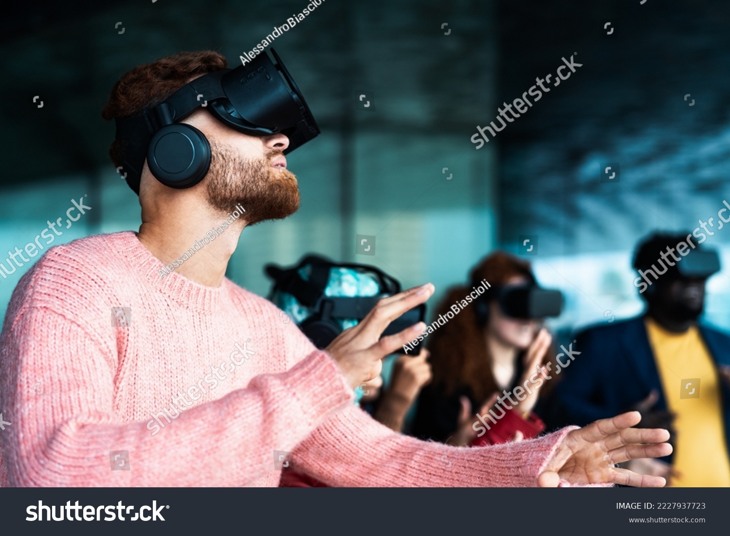 Young friends with simulation experience with futurist virtual reality glasses - Technology and metaverse concept #2227937723