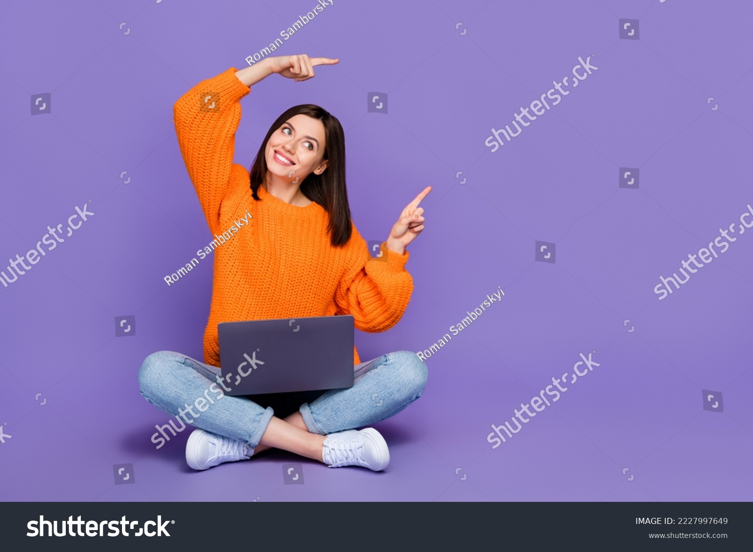 Full body photo of nice young girl netbook look direct empty space wear trendy orange knitwear garment isolated on violet color background #2227997649