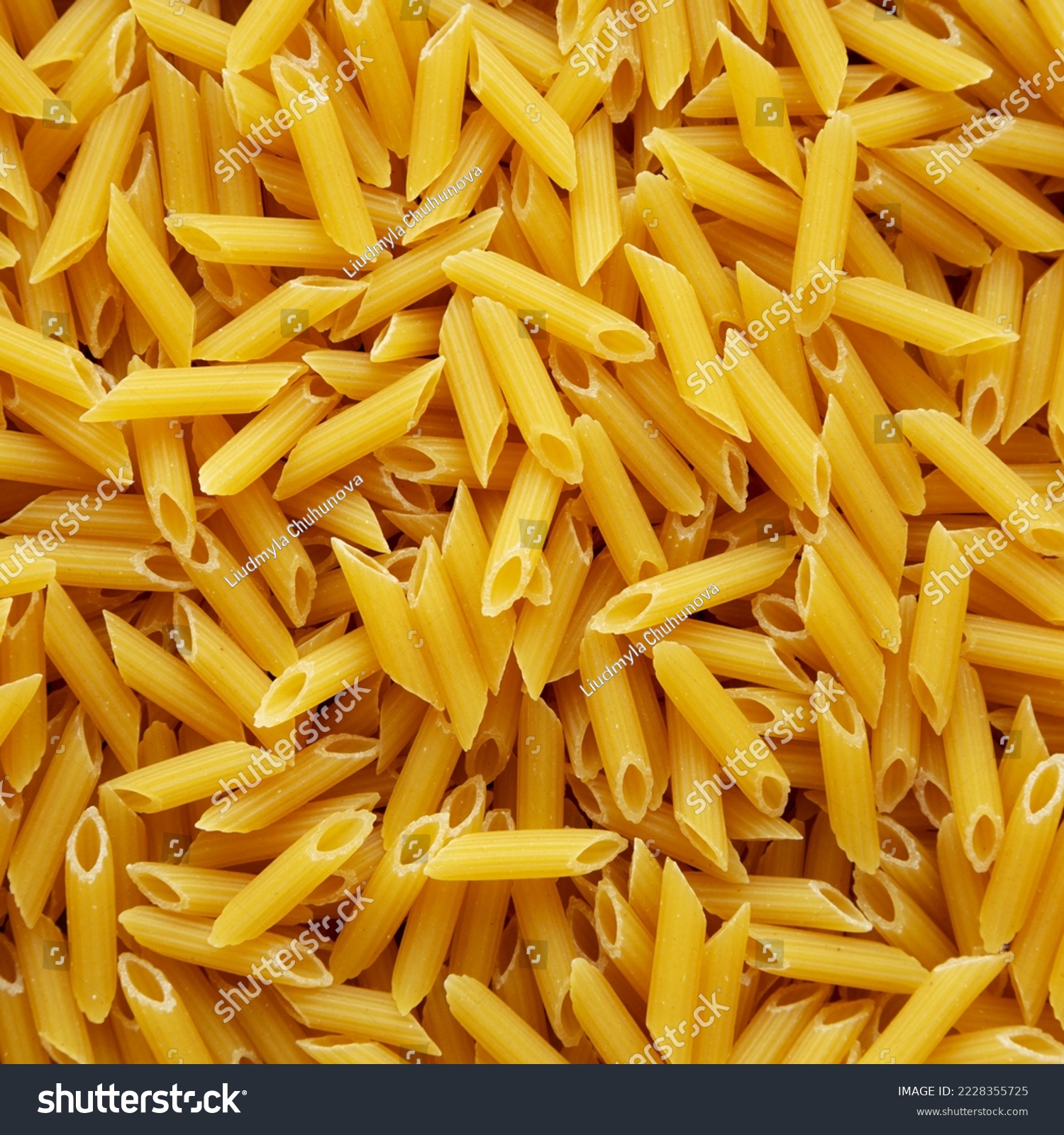 Homemade Raw Dry Mini Penne Pasta background #2228355725