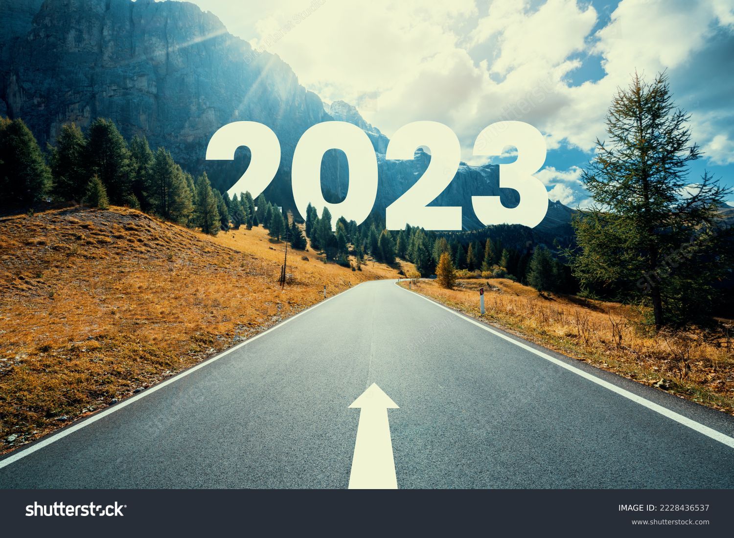 2023 New Year road trip travel and future vision concept . Nature landscape with highway road leading forward to happy new year celebration in the beginning of 2023 for fresh and successful start . #2228436537