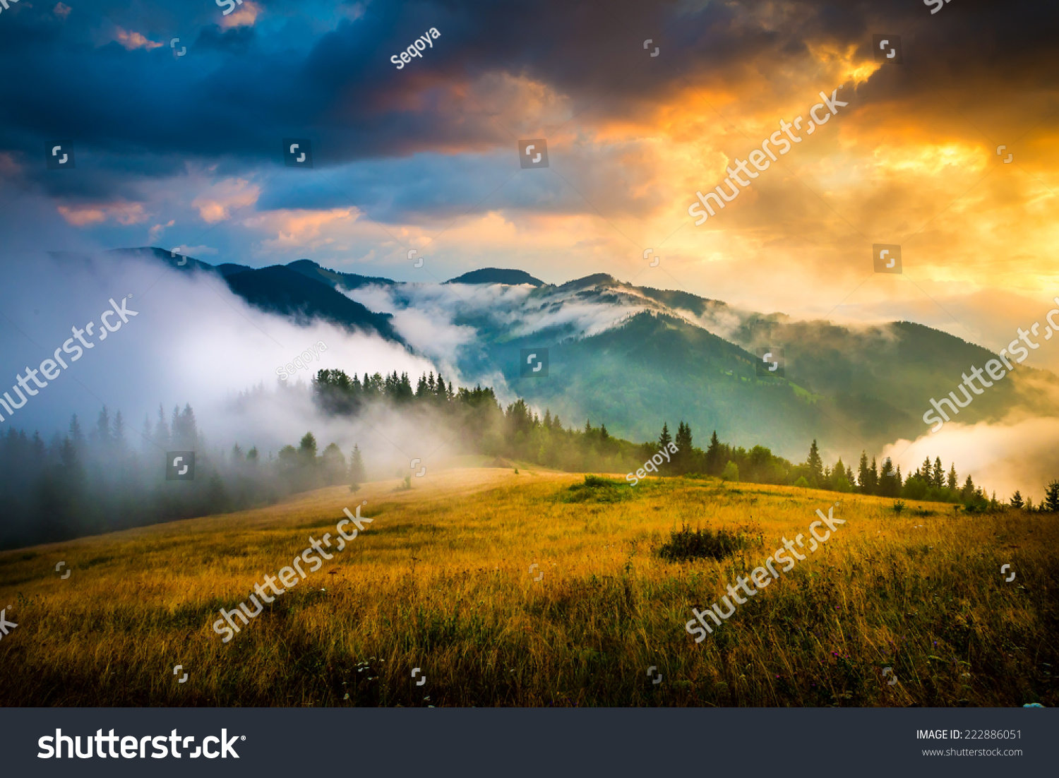 Amazing mountain landscape with fog and a haystack #222886051