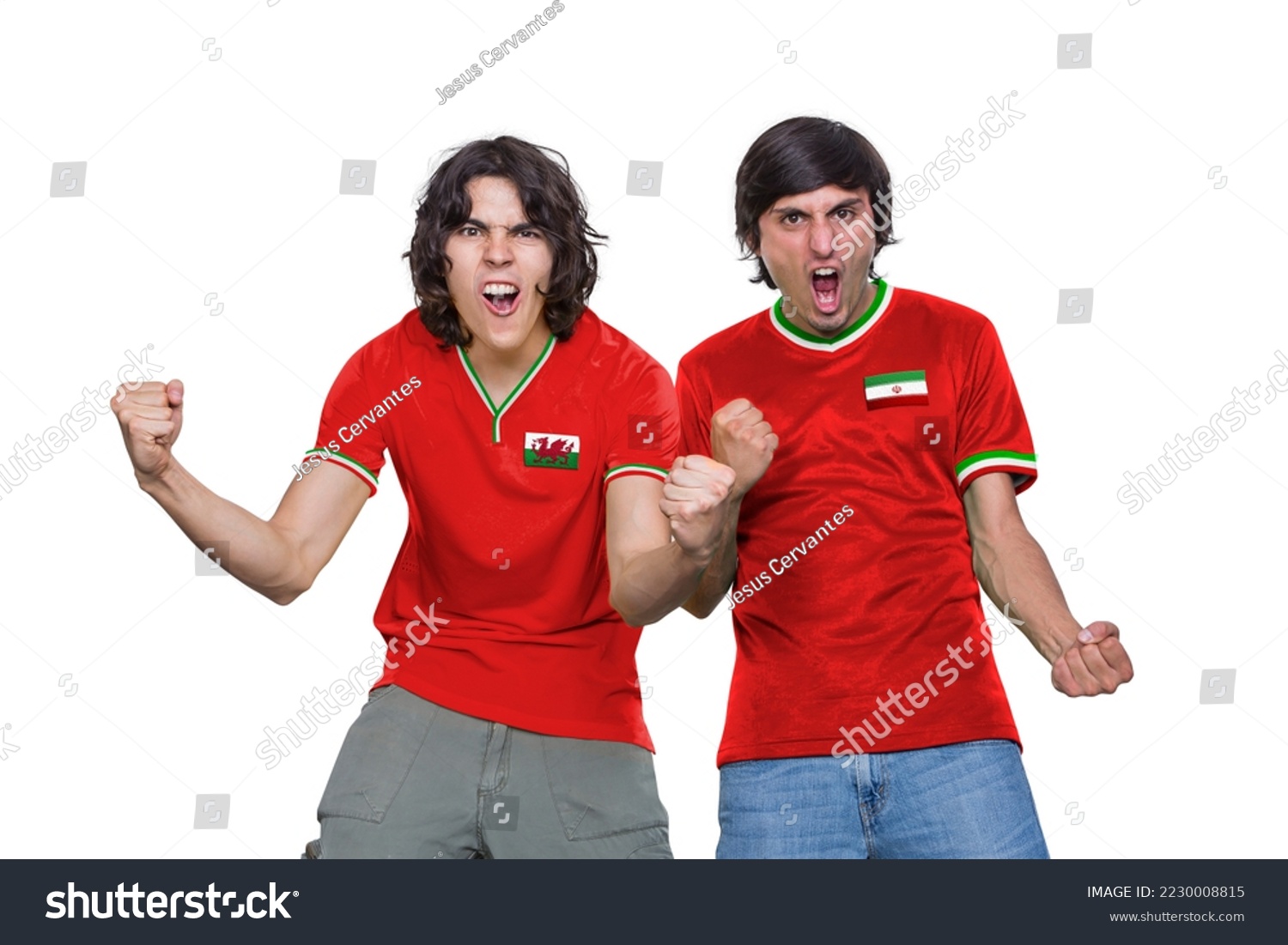 Two Soccer fans man with jersey and face painted with the flag of the Wales and IR IRAN teams screaming with emotion on white background. #2230008815