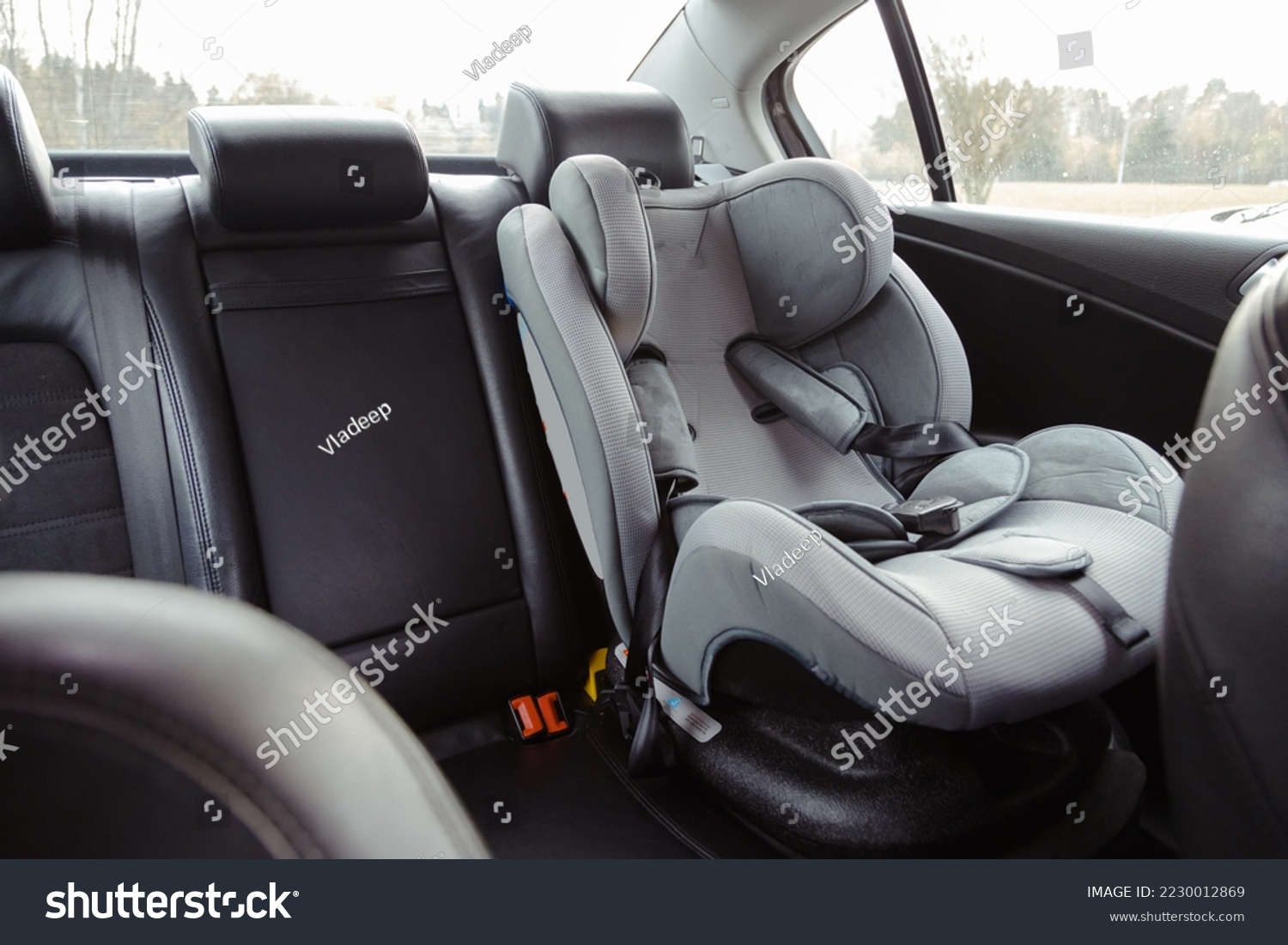 Child car seat for safety in the rear passenger seat of a car. #2230012869
