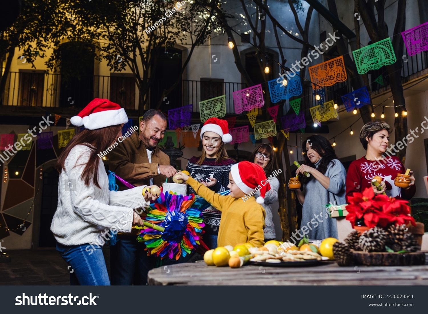 Posada, Mexican family Singing carols in Christmas party in Mexico Latin people #2230028541