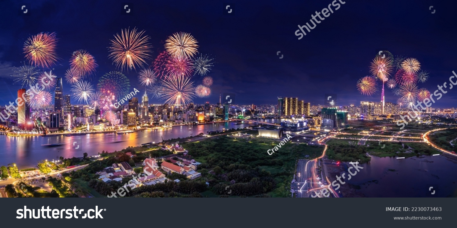 Celebration. Aerial view with fireworks light up sky over business district in Ho Chi Minh City( Saigon ), Vietnam. Beautiful night view cityscape. Holidays, independence day, New Year and Tet holiday #2230073463