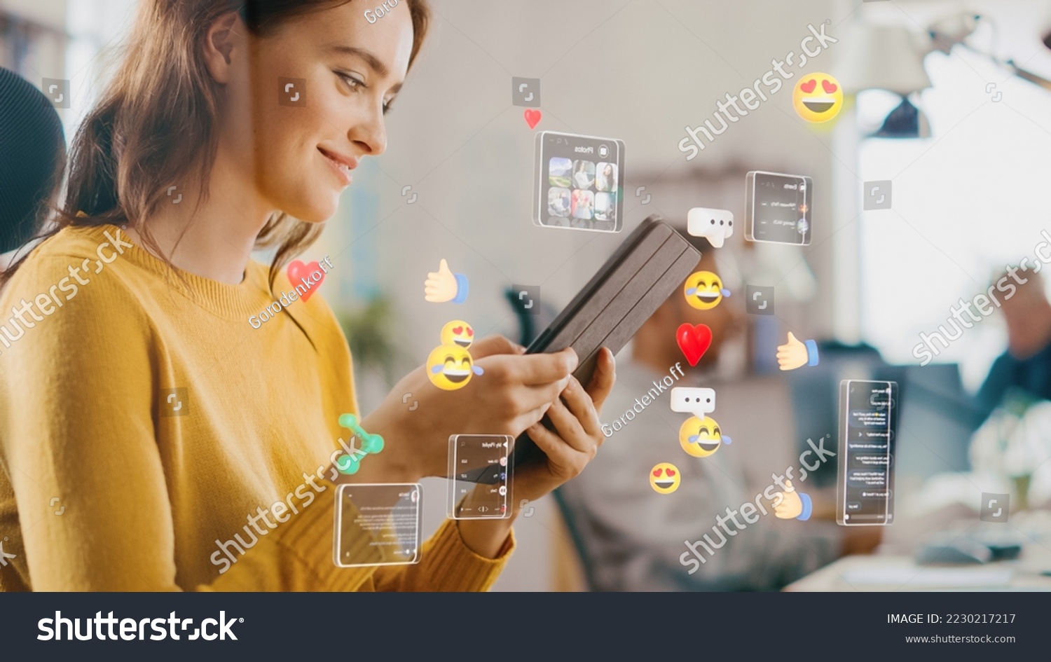 Social Media Visualization Concept: Happy Young Woman Uses Digital Tablet Computer in the Office, Social Media Posts, Smiley Faces, e-Commerce Online Shopping Digital Icons Flying Around the Device #2230217217