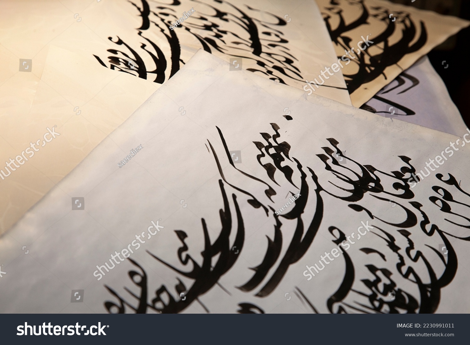 Persian calligraphy paper. A background of Persian calligraphy works. The papers are placed together. Interwoven writings. A writing of the repetition of the words "me, me, pub, pub, morning, morning" #2230991011
