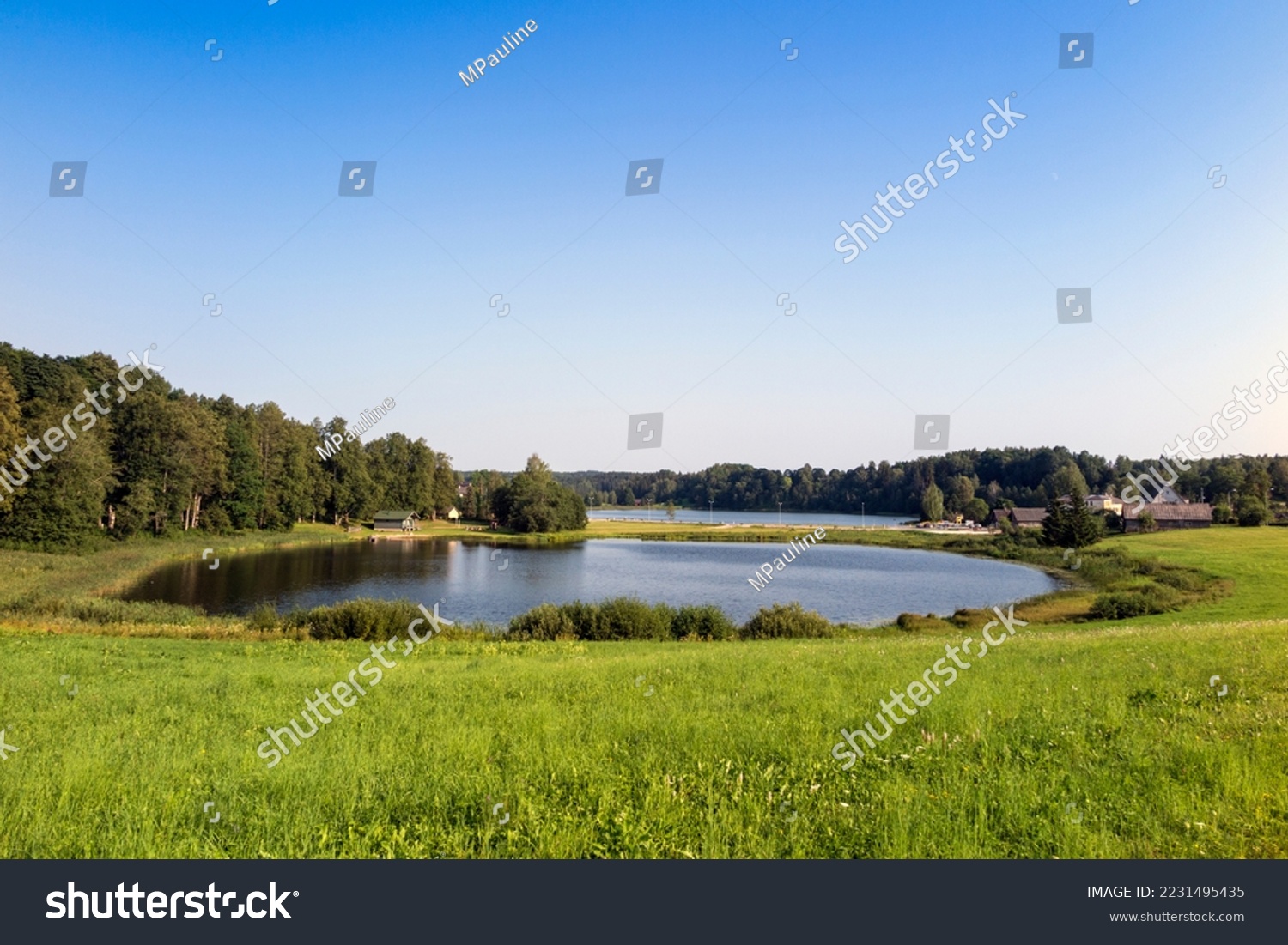 Lake Kaussjärv in Võru county, Estonia. Small lake, green grass. #2231495435