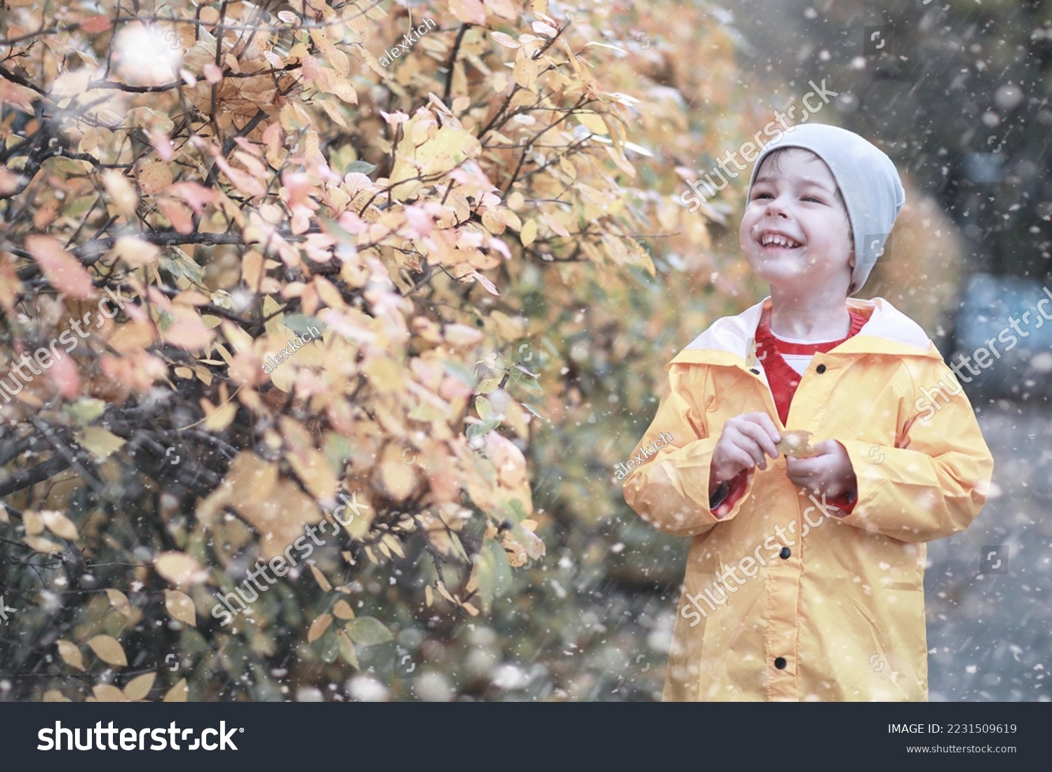 Kids walk in the park with first snow #2231509619