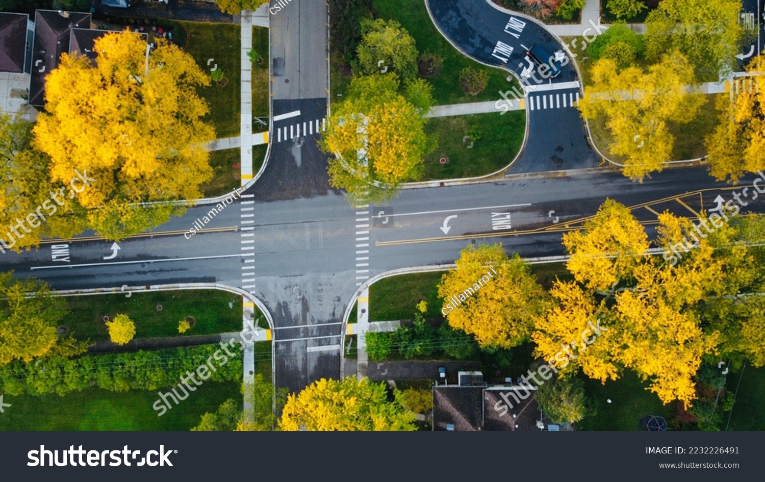 Fall colors in a suburban intersection #2232226491
