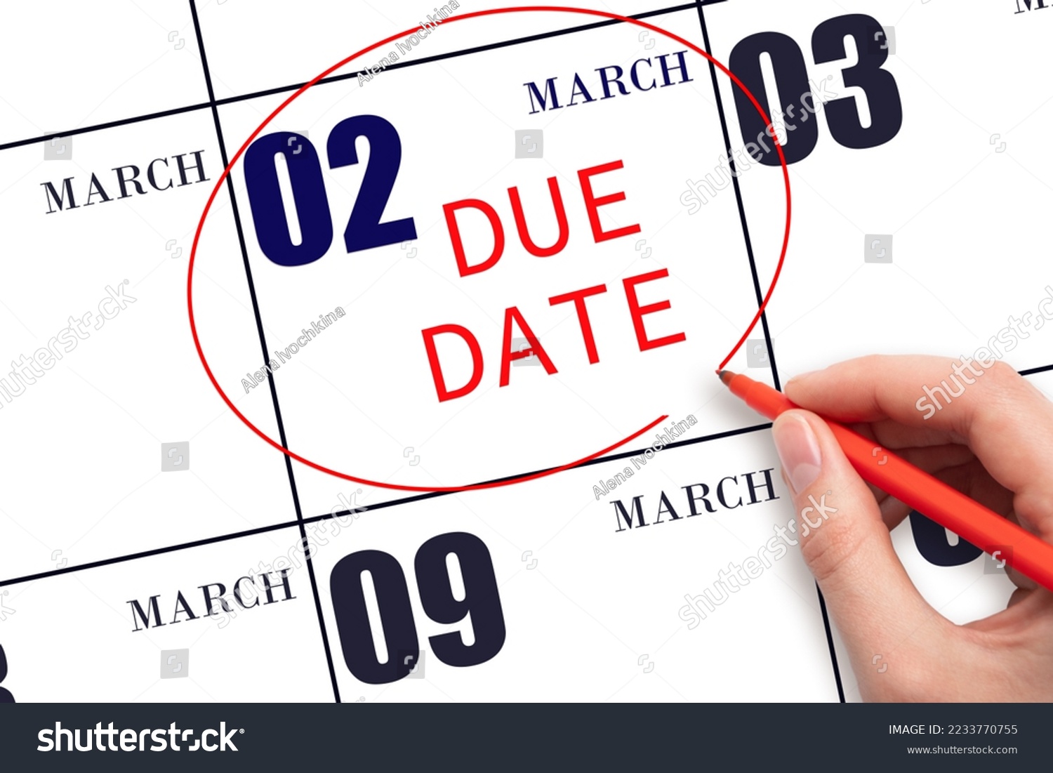 2nd day of March. Hand writing text DUE DATE on calendar date March 2 and circling it. Payment due date. Business concept. Spring month, day of the year concept. #2233770755