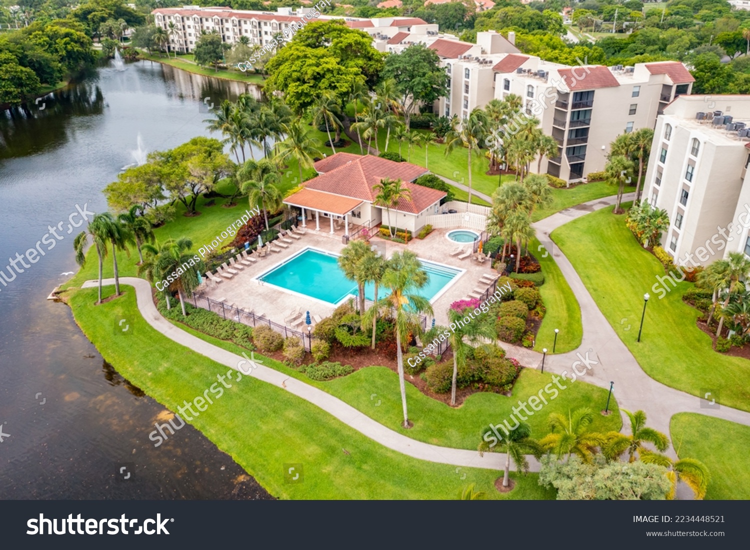 Aerial drone view to the suburbs in Delray Beach in Miami Florida, there is large tropical vegetation, houses with tiles #2234448521
