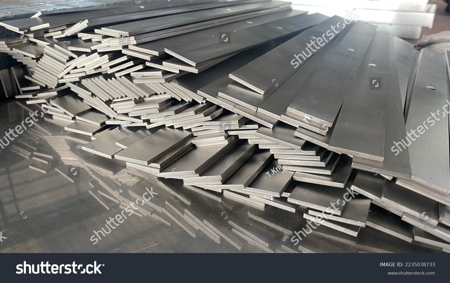 Stack of stainless steel flat bar of background.  #2235038733
