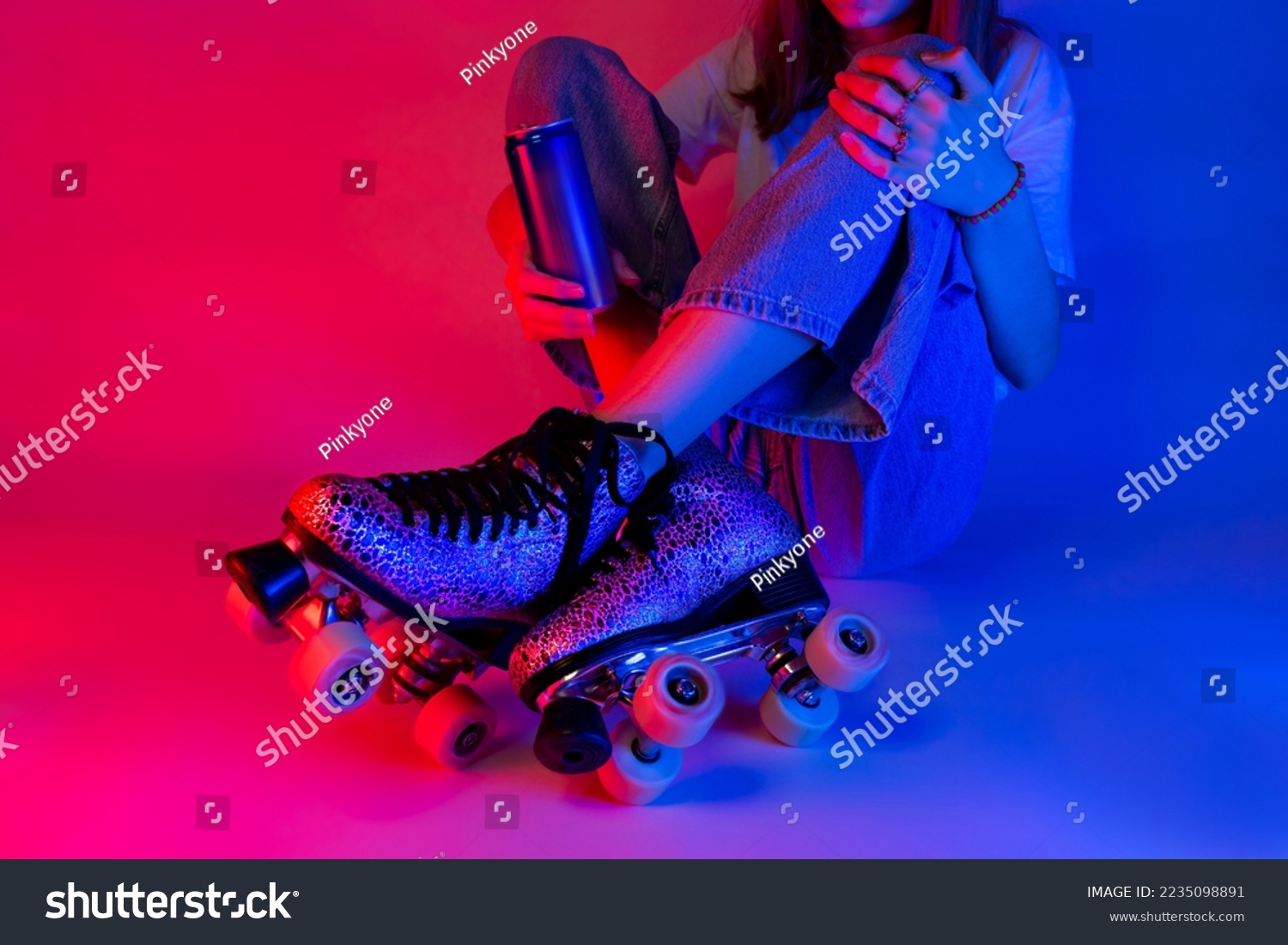 Roller skater holding a soda drink in a can during rest. Skating - sports and recreation. Saturated pink and blue, pop art style poster. #2235098891