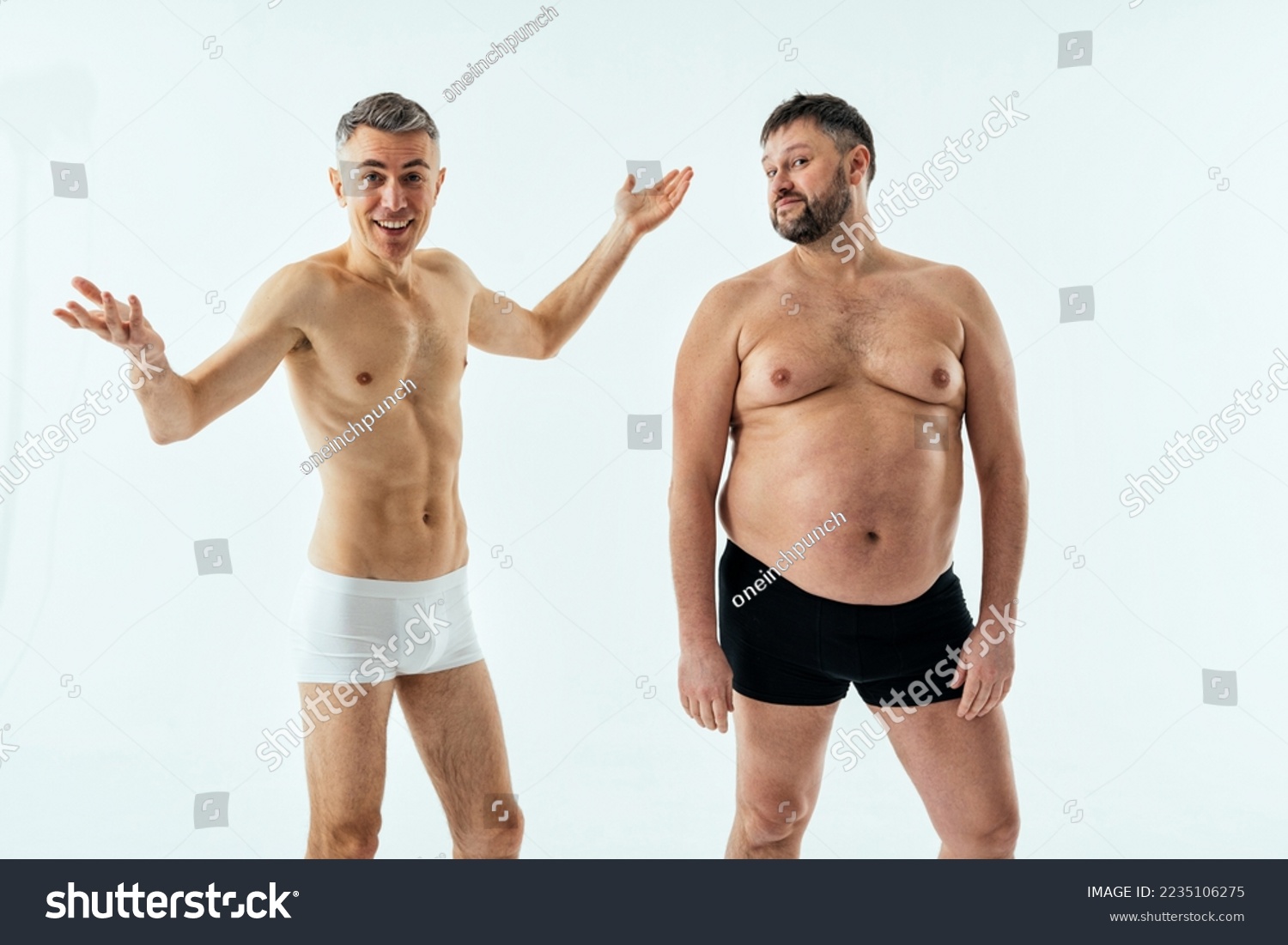 Two multiethnic men posing for a male edition body positive beauty set. Shirtless guys with different age, and body wearing boxers underwear #2235106275