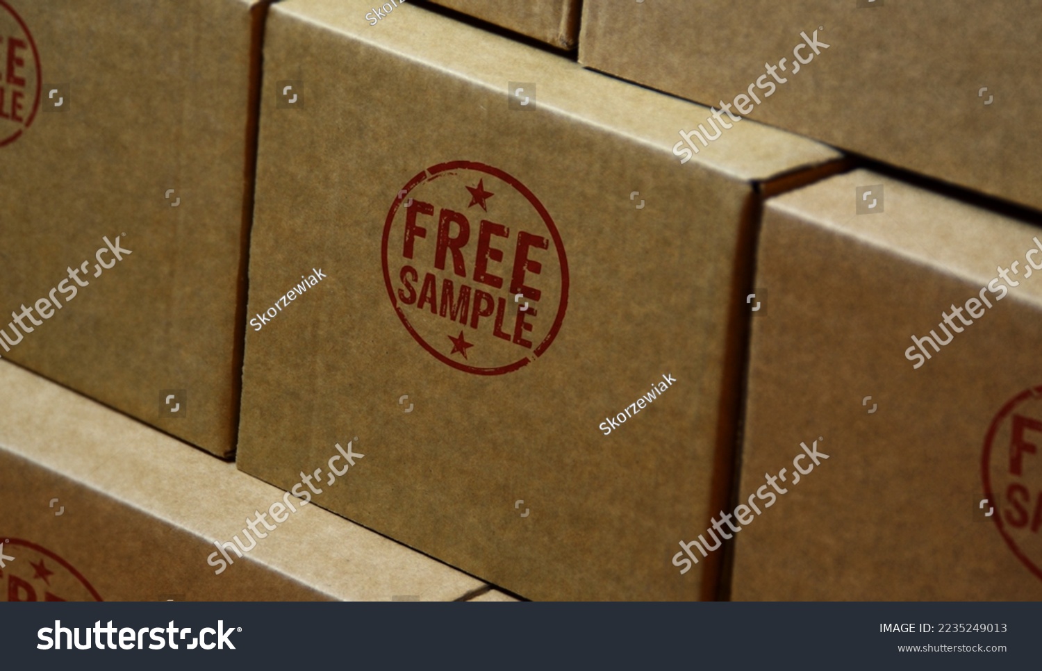 Free sample stamp printed on cardboard box. Gratis shopping retail product promotion concept. #2235249013