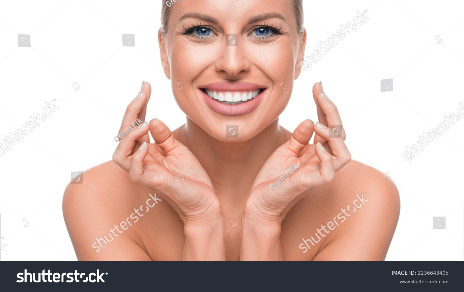 Happy smiling woman touching her face. Anti-age skin cate and tooth whitening concept. #2236643405