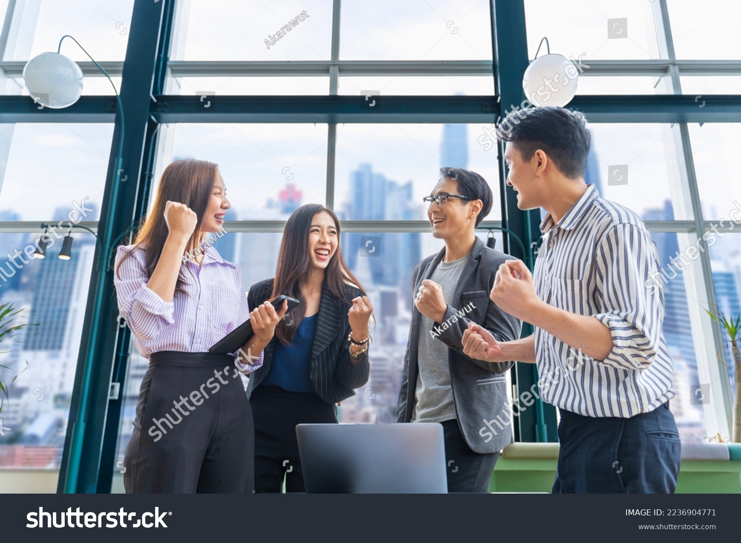 Team of young Asian entrepreneurs and startup have business meeting and encouraging each other for good spirit energy to accomplish successful marketing plan concept #2236904771