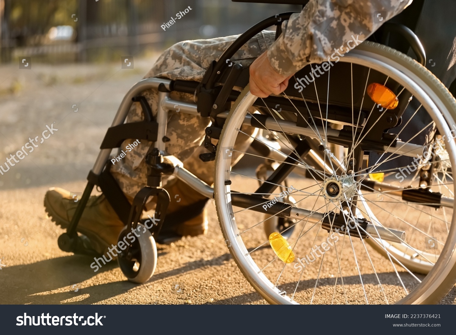 Young soldier in wheelchair outdoors, closeup #2237376421