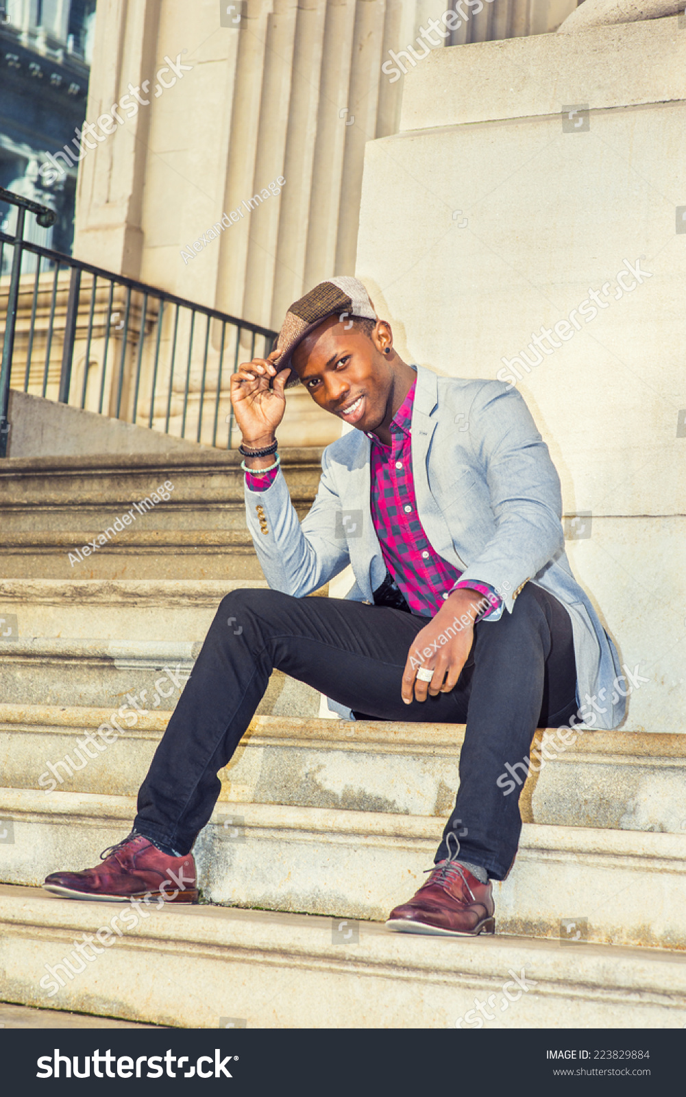 purple shirt and brown pants