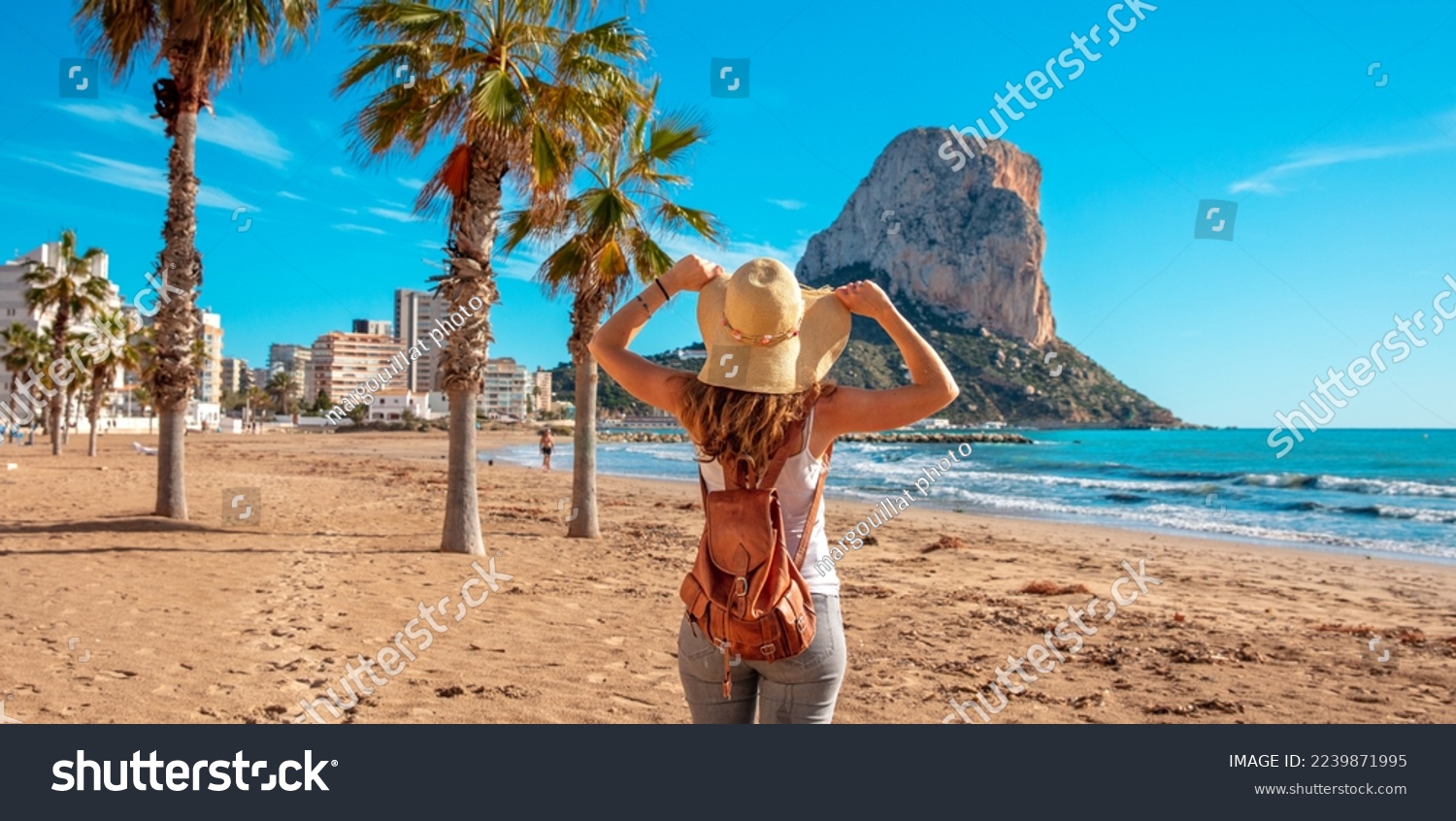 Woman tourist on the tropical beach,  Calpe,  Alicante province in Spain, costa blanca #2239871995