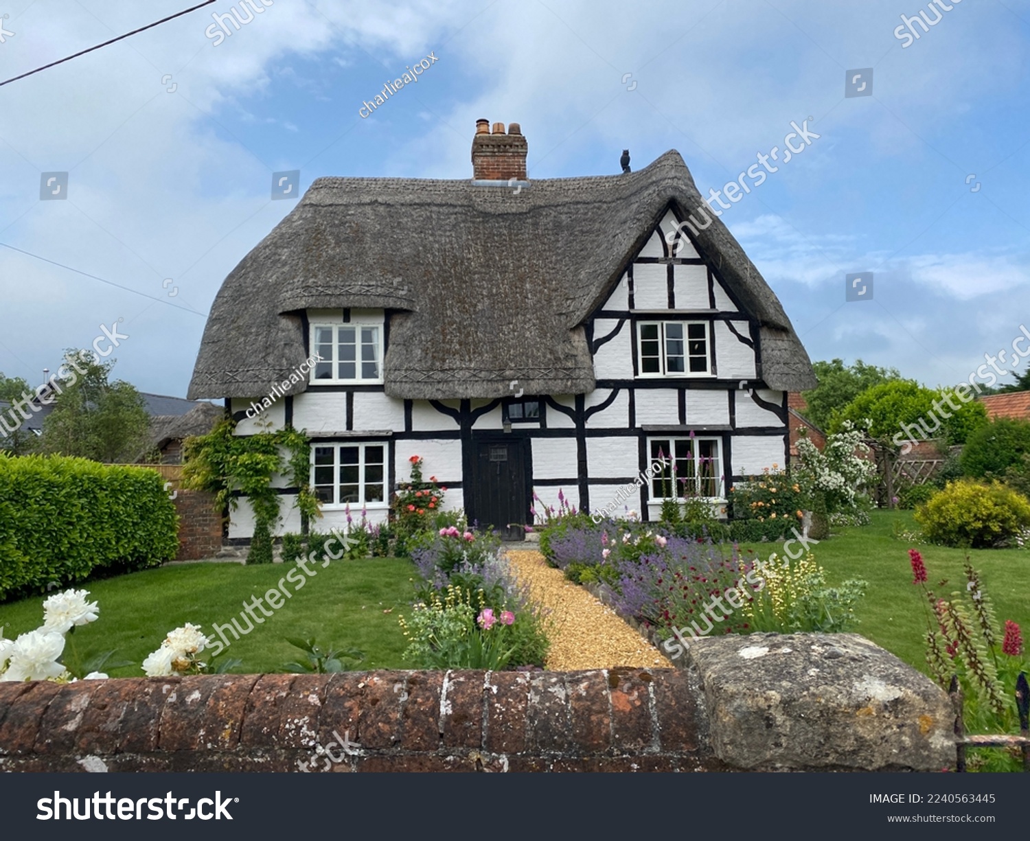 A thatched-roof home in the heart of Somerset, England. #2240563445