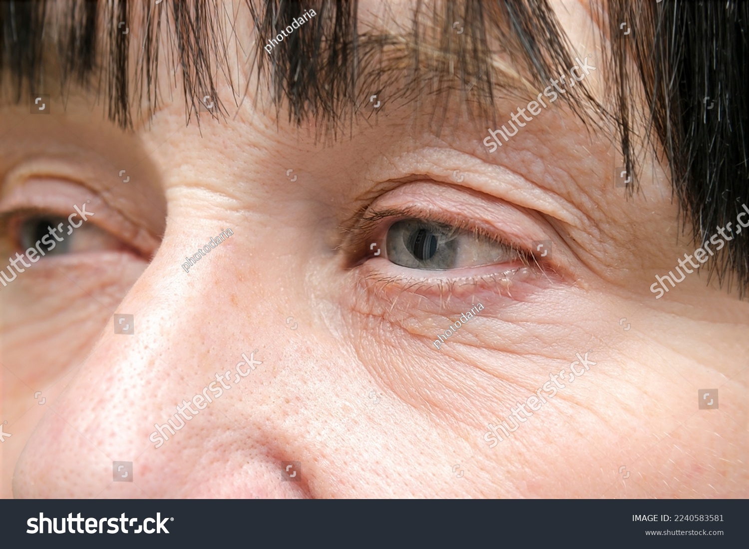 Portrait of wrinkled face of elderly mature older middle aged woman, close up of beautiful female eyes with dry skin.cosmetology care treatment,age skin care beauty cream,medicine,plastic surgery #2240583581