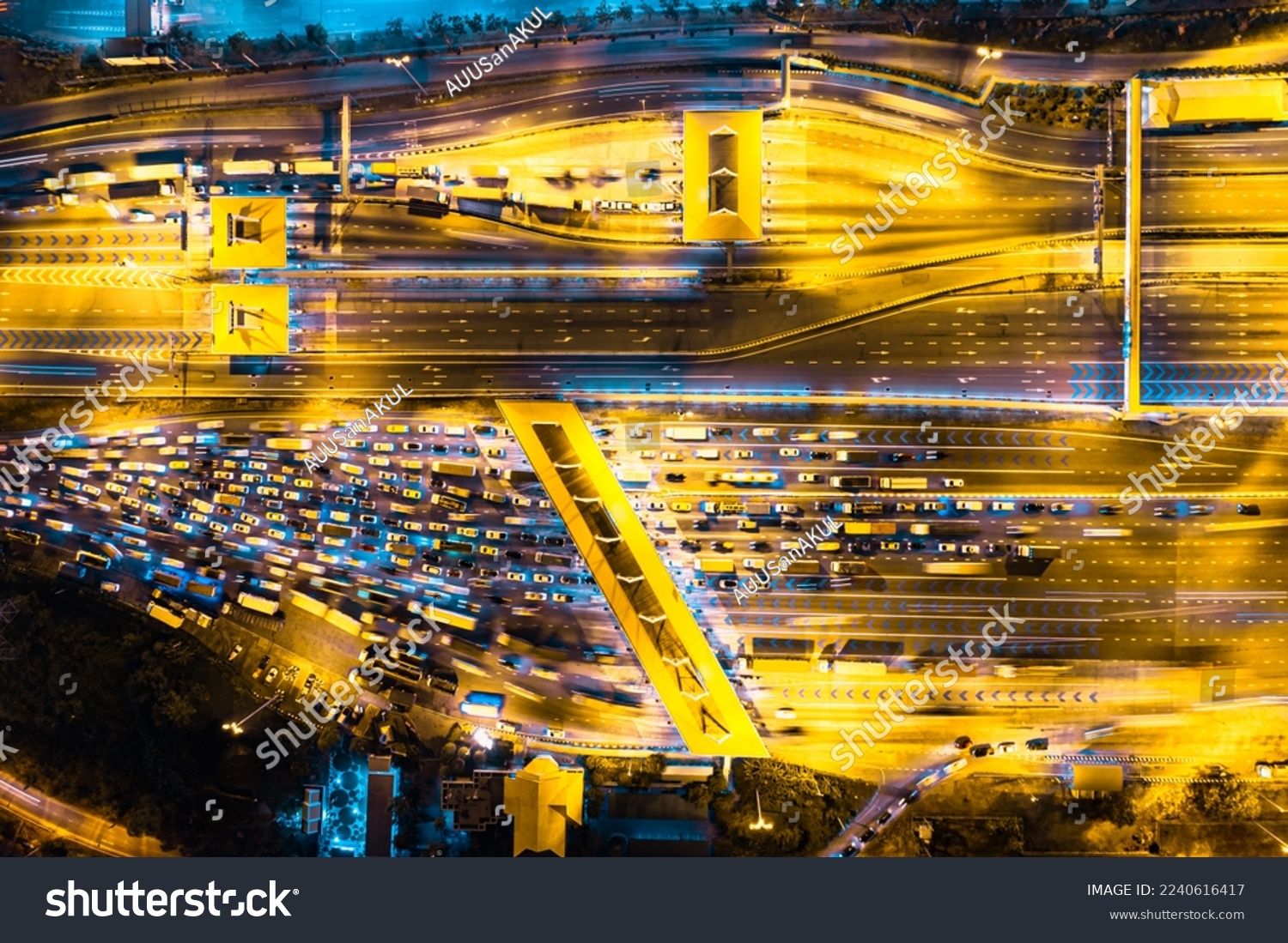Aerial view of Cars Passing Through The Automatic Point Of Payment On motorway Toll Road at night. Point Of Toll Highway, Toll Station. Highway Toll Plaza Or Turnpike Or Charging Point, Expressway #2240616417