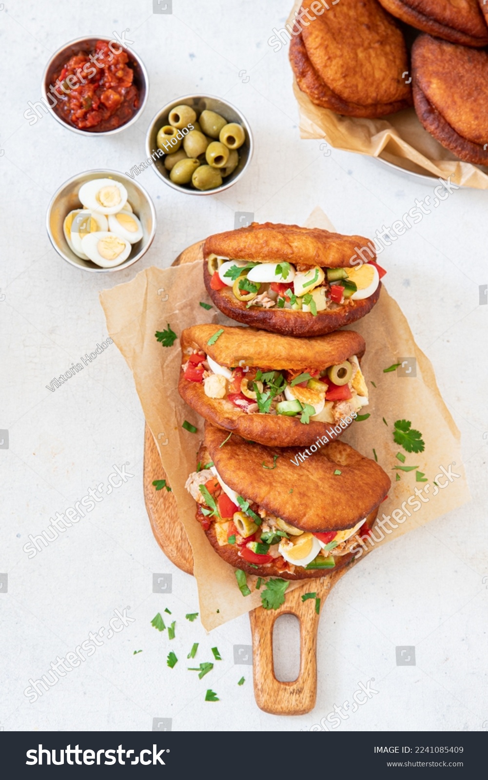 Fricasse is a savory donut  filled tuna, potato,boiled egg, olives and harissa.Traditional Tunisian food #2241085409