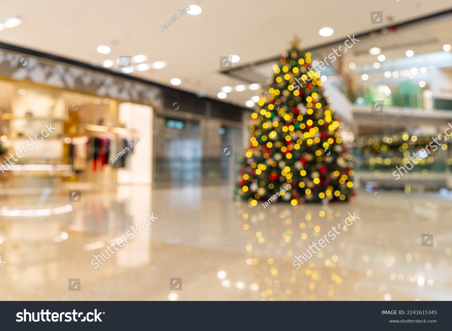 blurred christmas tree in large shopping mall as background #2241615345