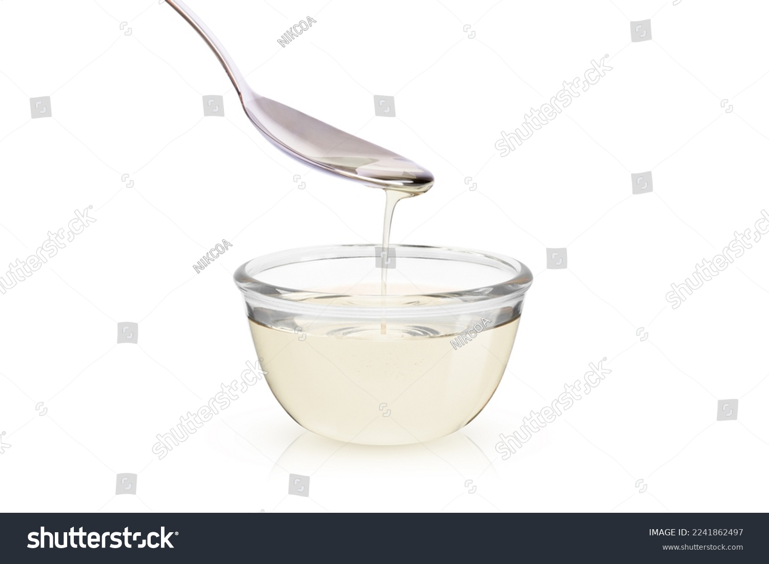 Sugar syrup in glass bowl isolated on white background  #2241862497