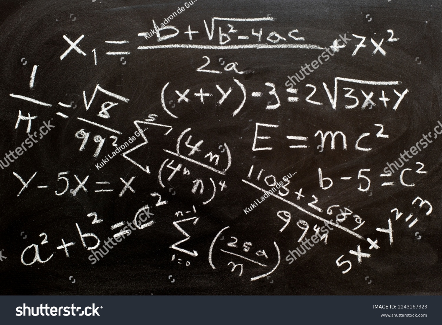 Mathematical formulas and equations written on a blackboard with chalk #2243167323