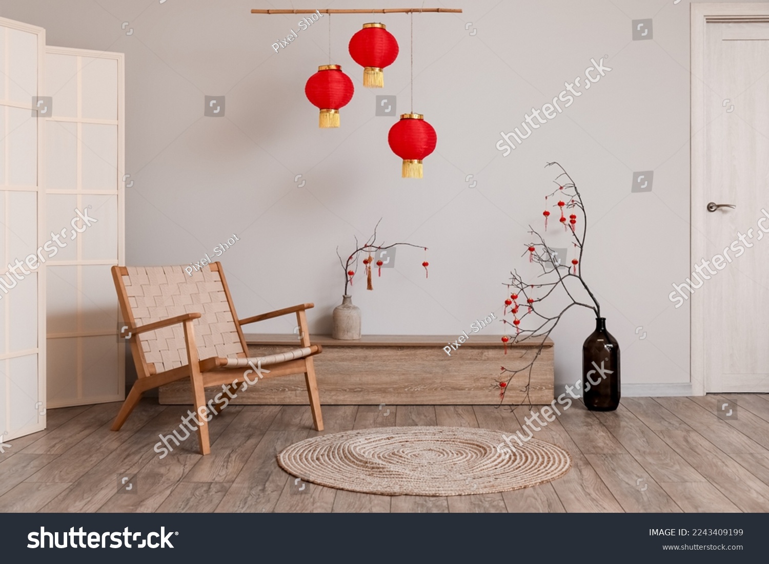 Interior of living room with armchair and decor for Chinese New Year celebration #2243409199