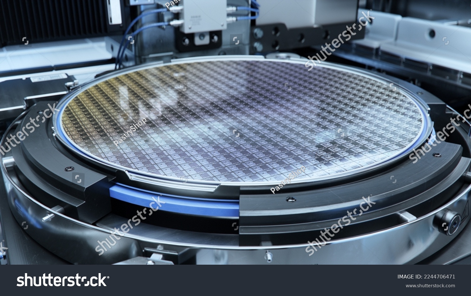 Close-up Shot of a Silicon Wafer inside Photolithography Machine. Shot of Wafer during Semiconductor and Computer Chip Manufacturing at Fab or Foundry. #2244706471