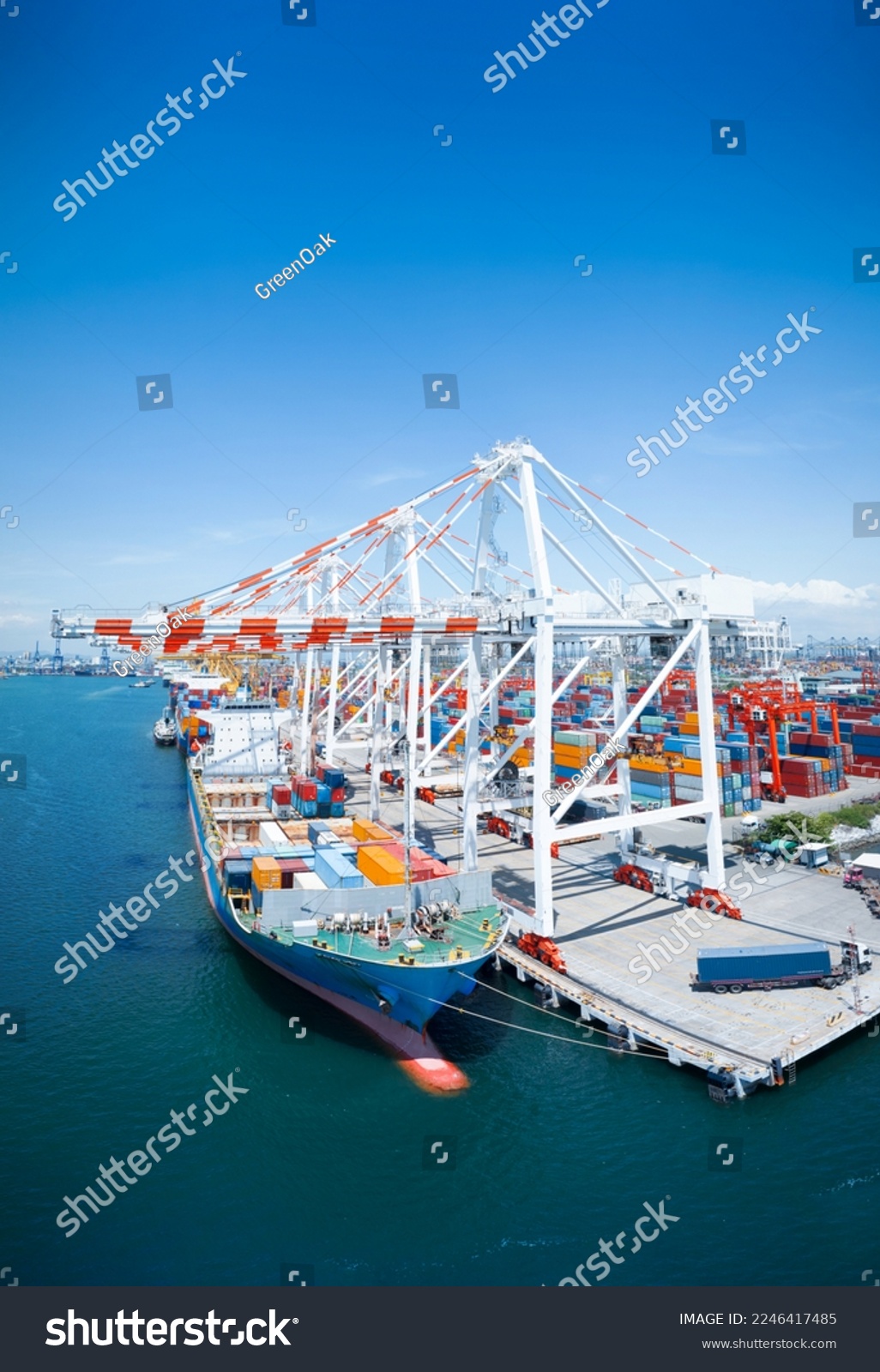 Crane loading cargo box to Large container Ship at Cargo Sea Port. Freight shipping container box transportation and logistics to Customs sea port. #2246417485