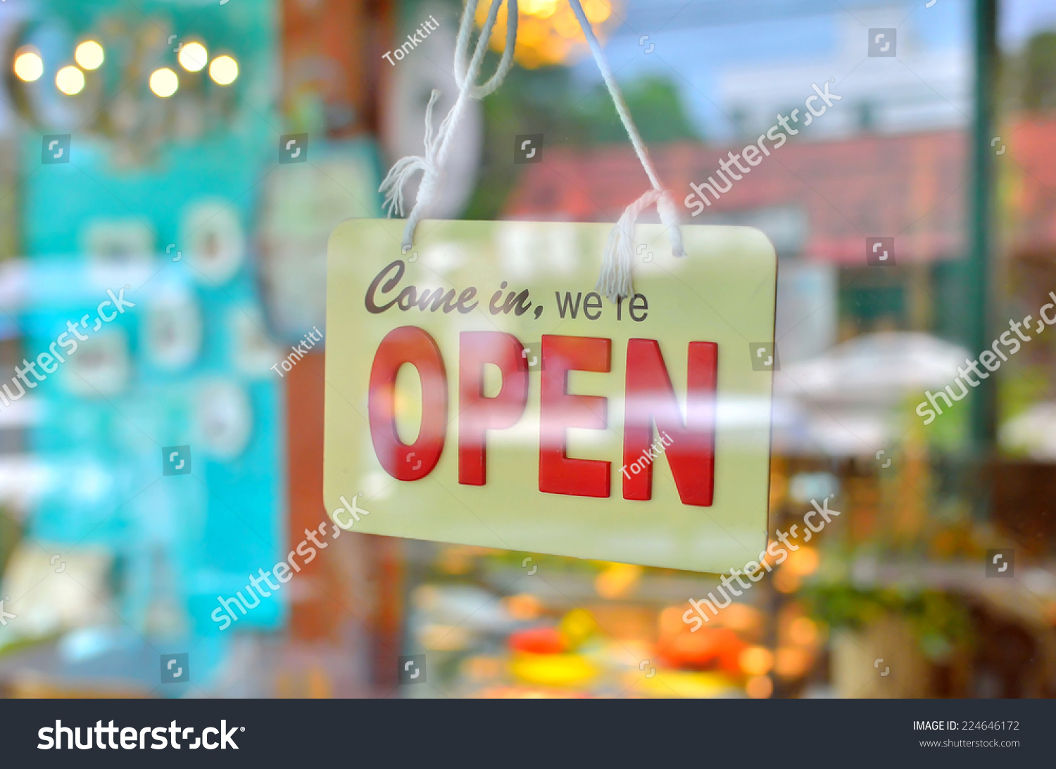 open sign broad through the glass of window at coffee shop #224646172