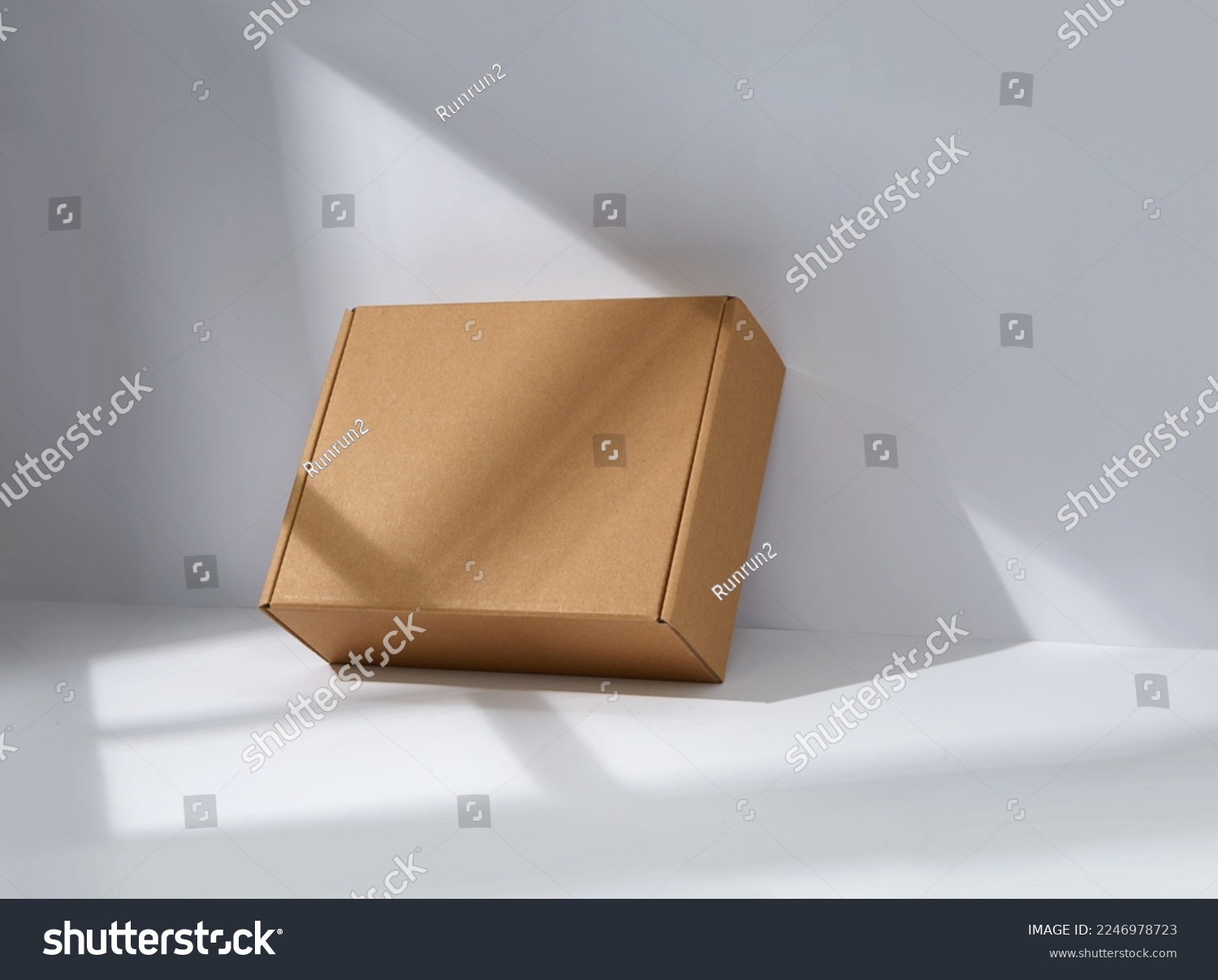 Empty cardboard Box with window shadow  #2246978723