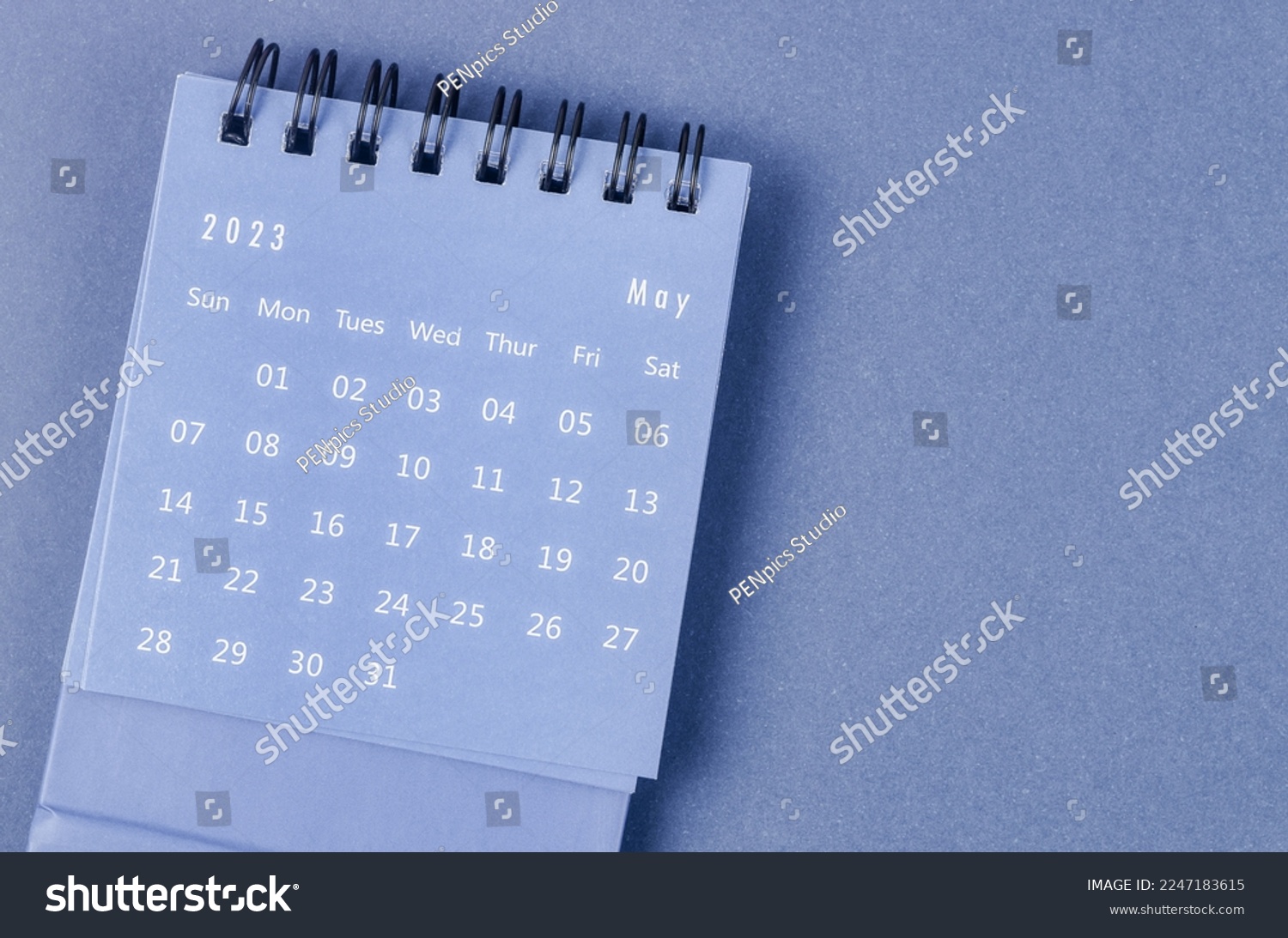 May 2023 Monthly desk calendar for 2023 year on blue background. #2247183615