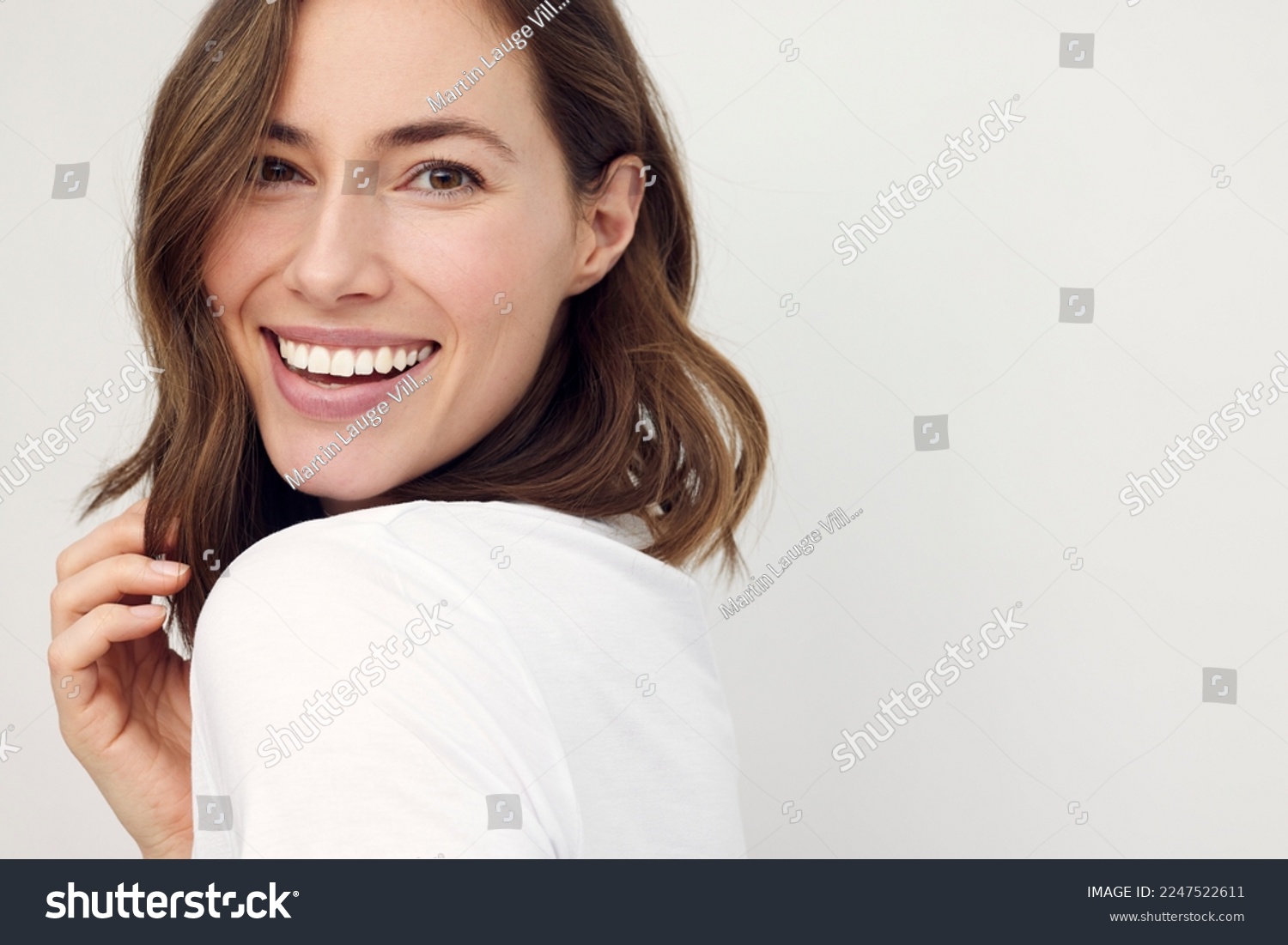 closeup portrait of young happy woman looking in camera	 #2247522611