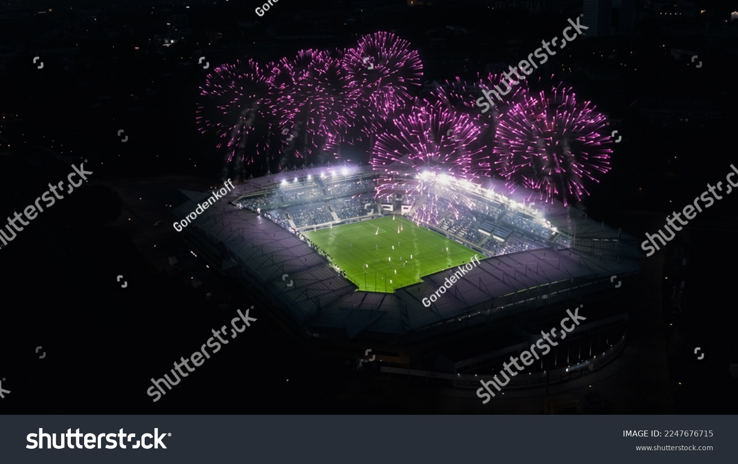 Aerial Establishing Shot of a Whole Stadium with Soccer Final Match Starting. Teams Play, Crowd of Fans Cheer, Fireworks Launched From Top of The Arena. Football Tournament, Cup TV Broadcast. #2247676715