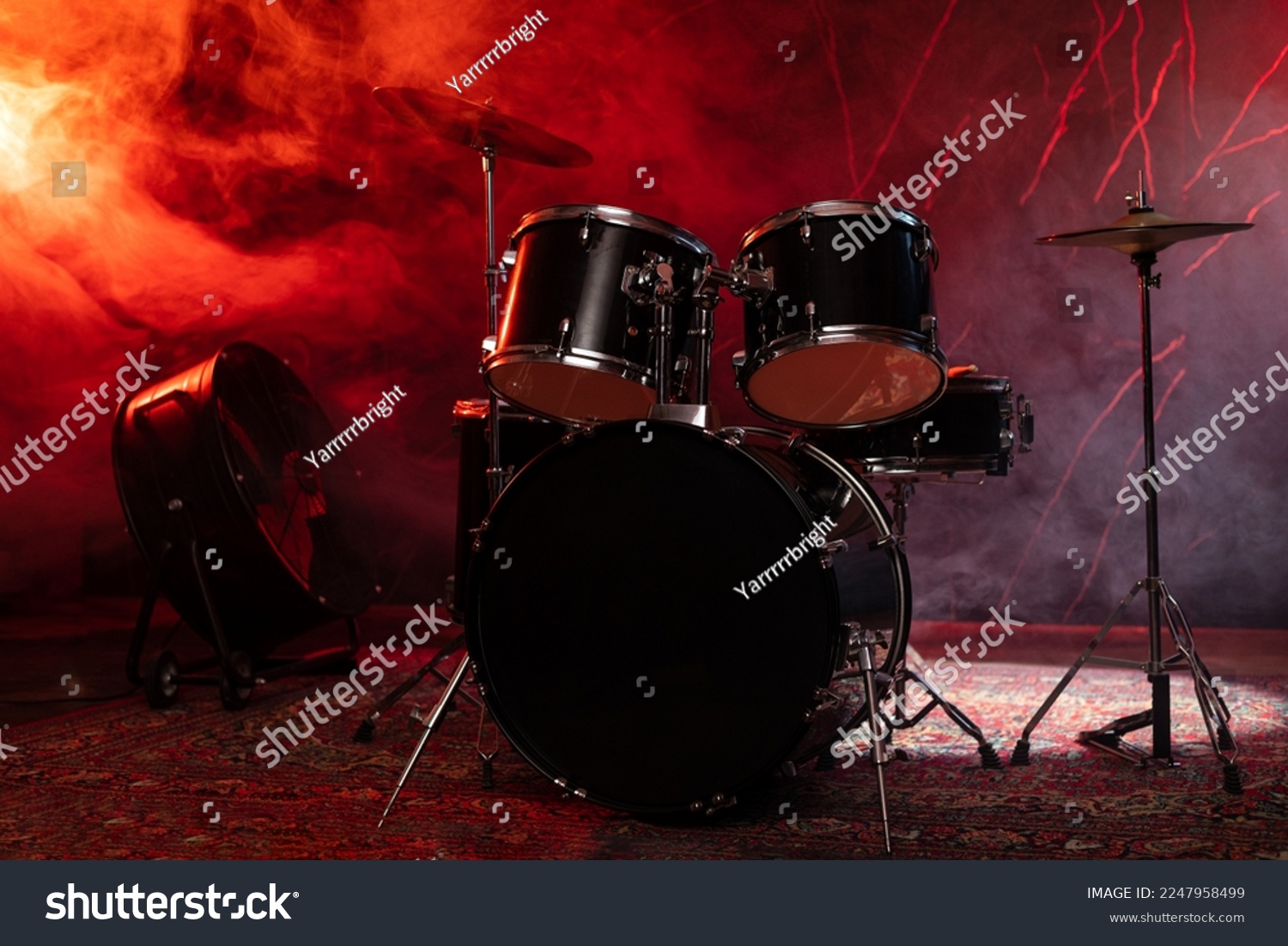 Drums and drum set. Beautiful blue and red background, with rays of light. Beautiful special effects of smoke and lighting. Musical instrument. The concept of music. Close-up photo. #2247958499