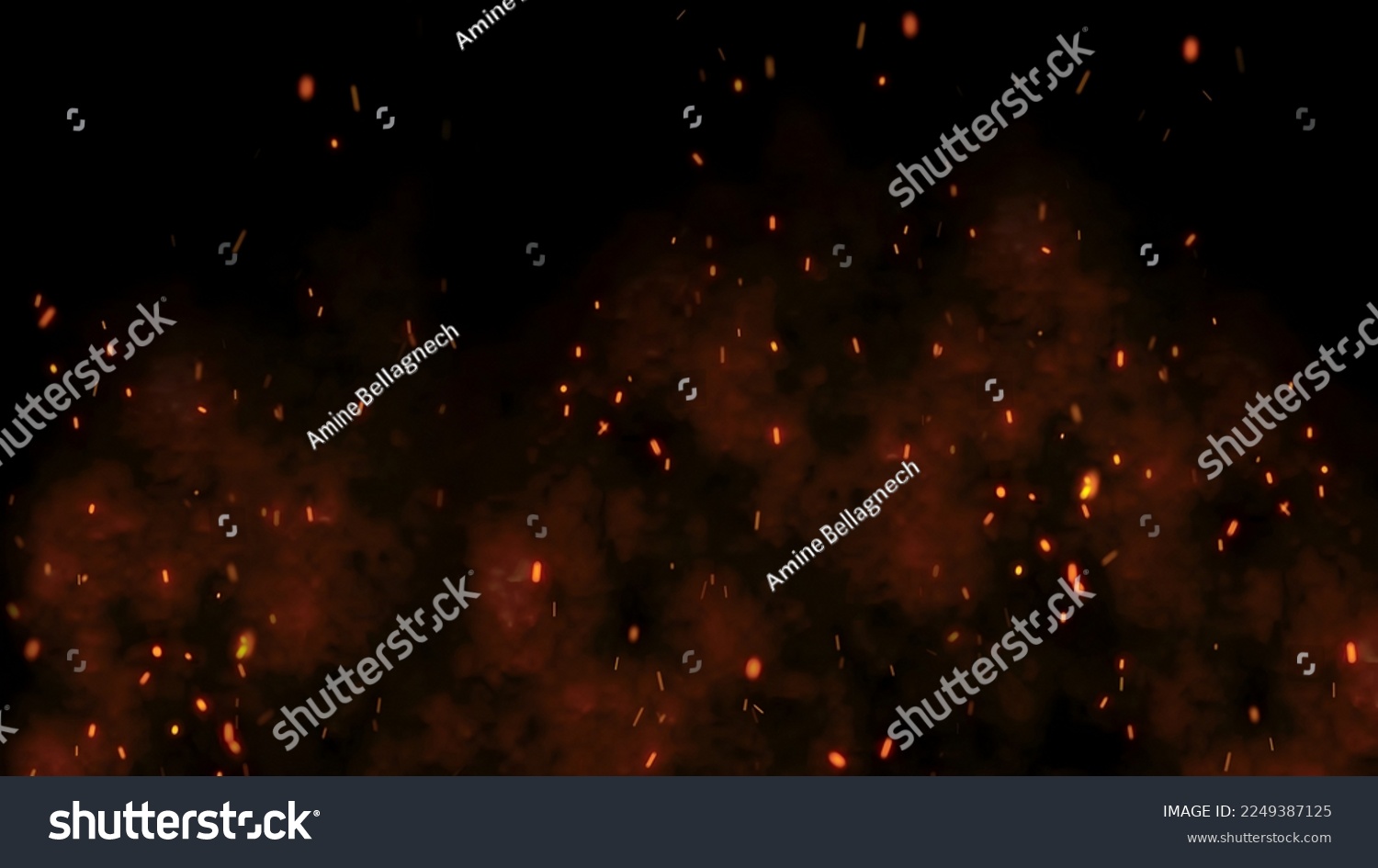 Burning red hot sparks rise from large fire in the night sky. Fiery orange glowing flying away particles over black background in 4k #2249387125