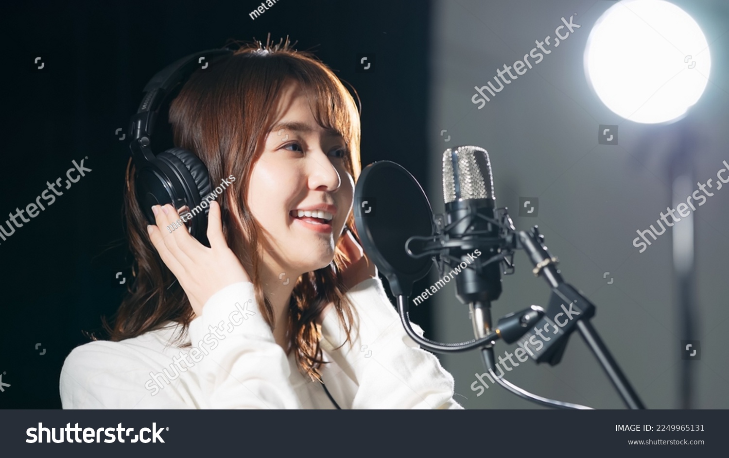 Female singer recording in studio. #2249965131