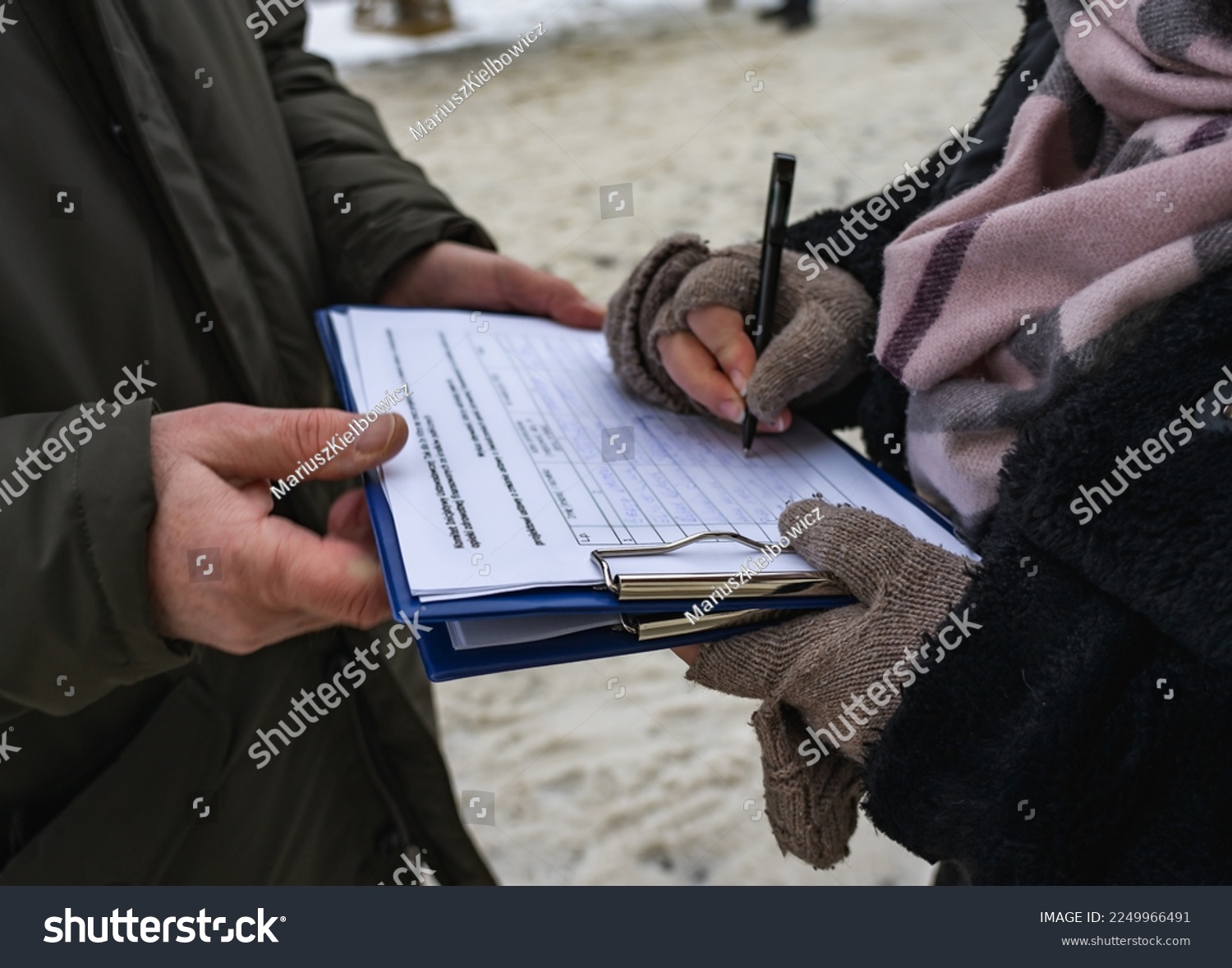 Activist collecting signatures for a petition #2249966491