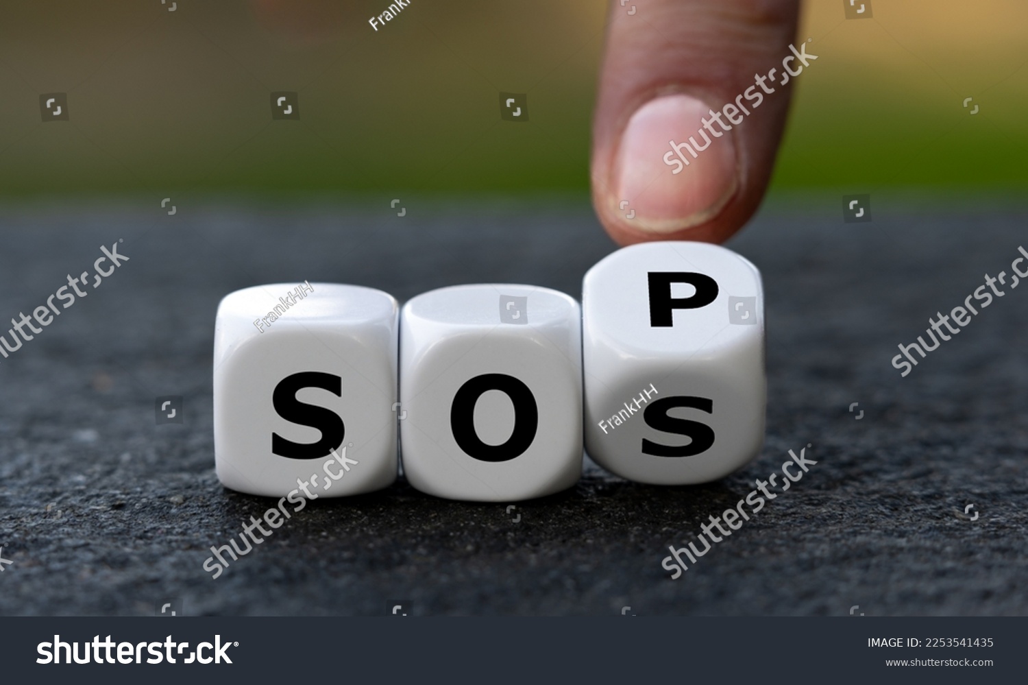 Hand turns dice and changes the abbreviation SOS (save our souls) to SOP (standard operating procedure). Symbol for getting help. #2253541435