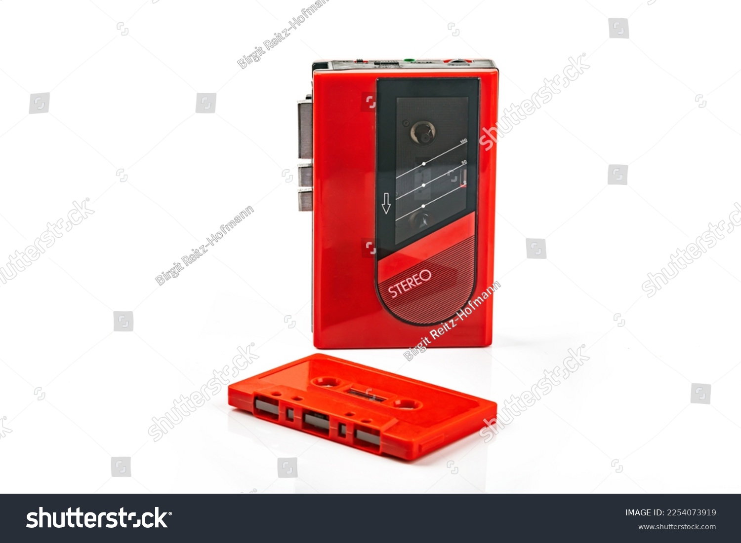 Beautiful red vintage audio cassette player over white background #2254073919