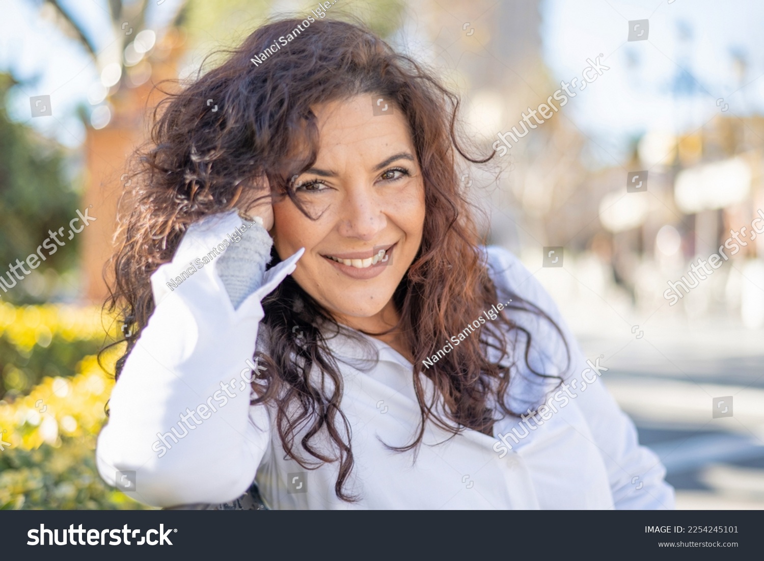 Woman Smiling. Happy Woman Enjoying A Spring Day In A City Park. #2254245101
