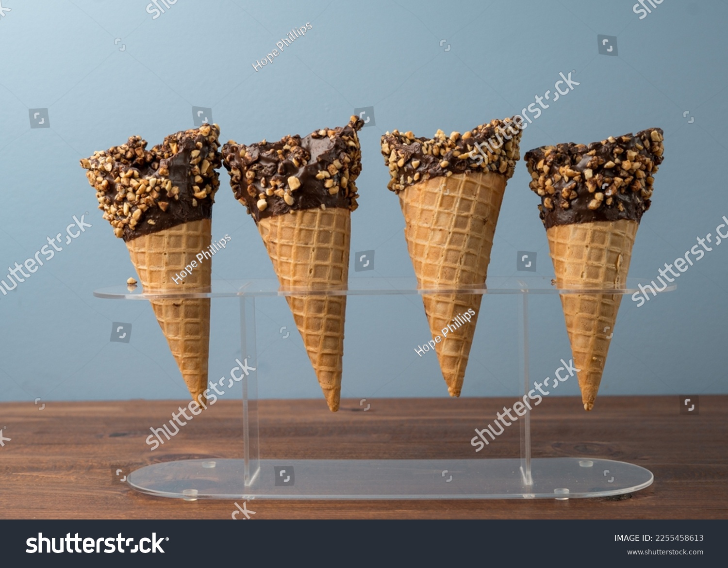 Chocolate dipped waffle cone with nuts #2255458613