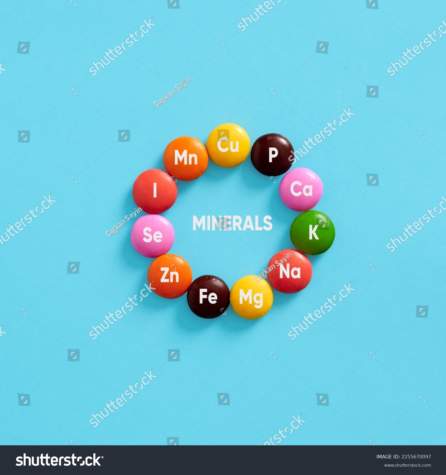 Nutritional mineral supplements. Health care. Minerals, body health and dieting. Essential Mineral symbols for body care on colorful pills. #2255670097