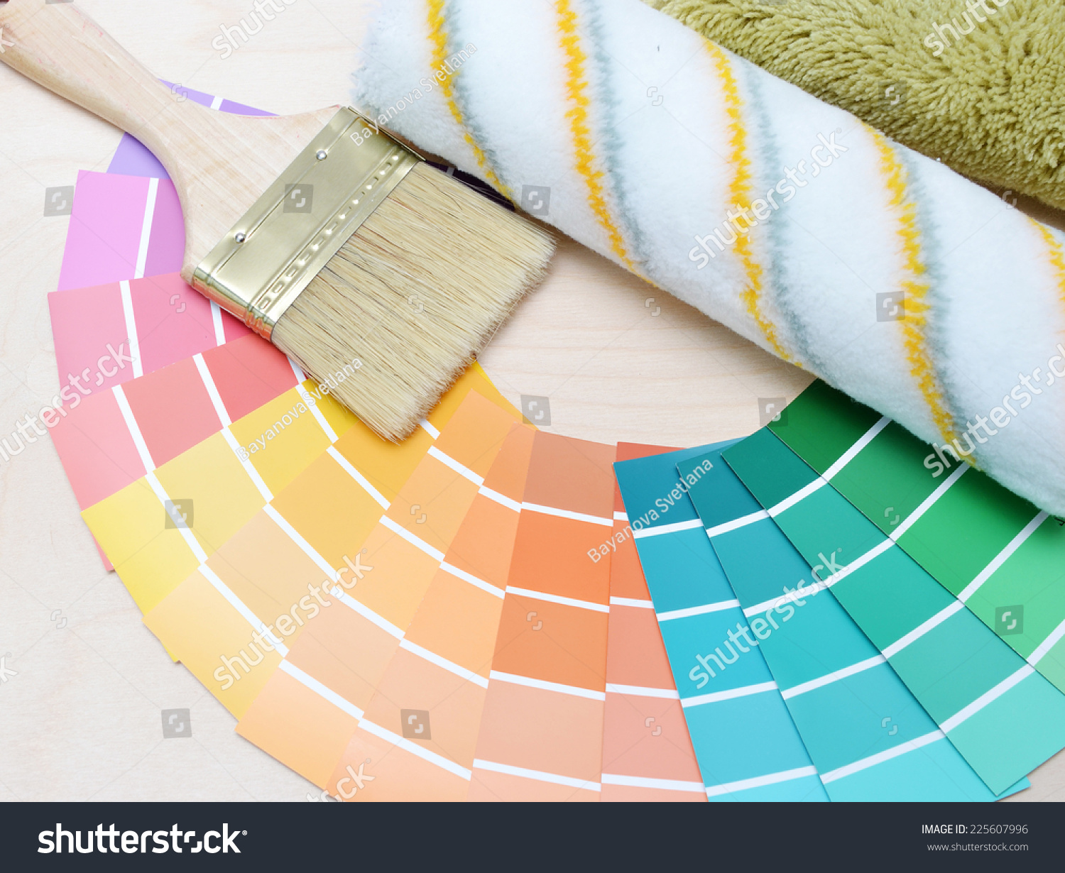 color palette and brush on a wooden background. #225607996